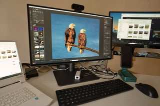Photo editing workstation with several monitors