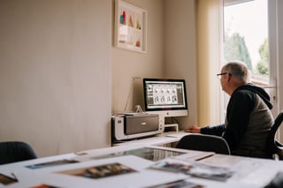 Photographer editing photos at a computer