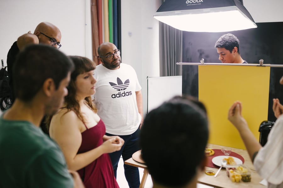 Group of photographers working together in a studio