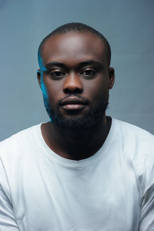 Adult studio headshot on a grey backdrop