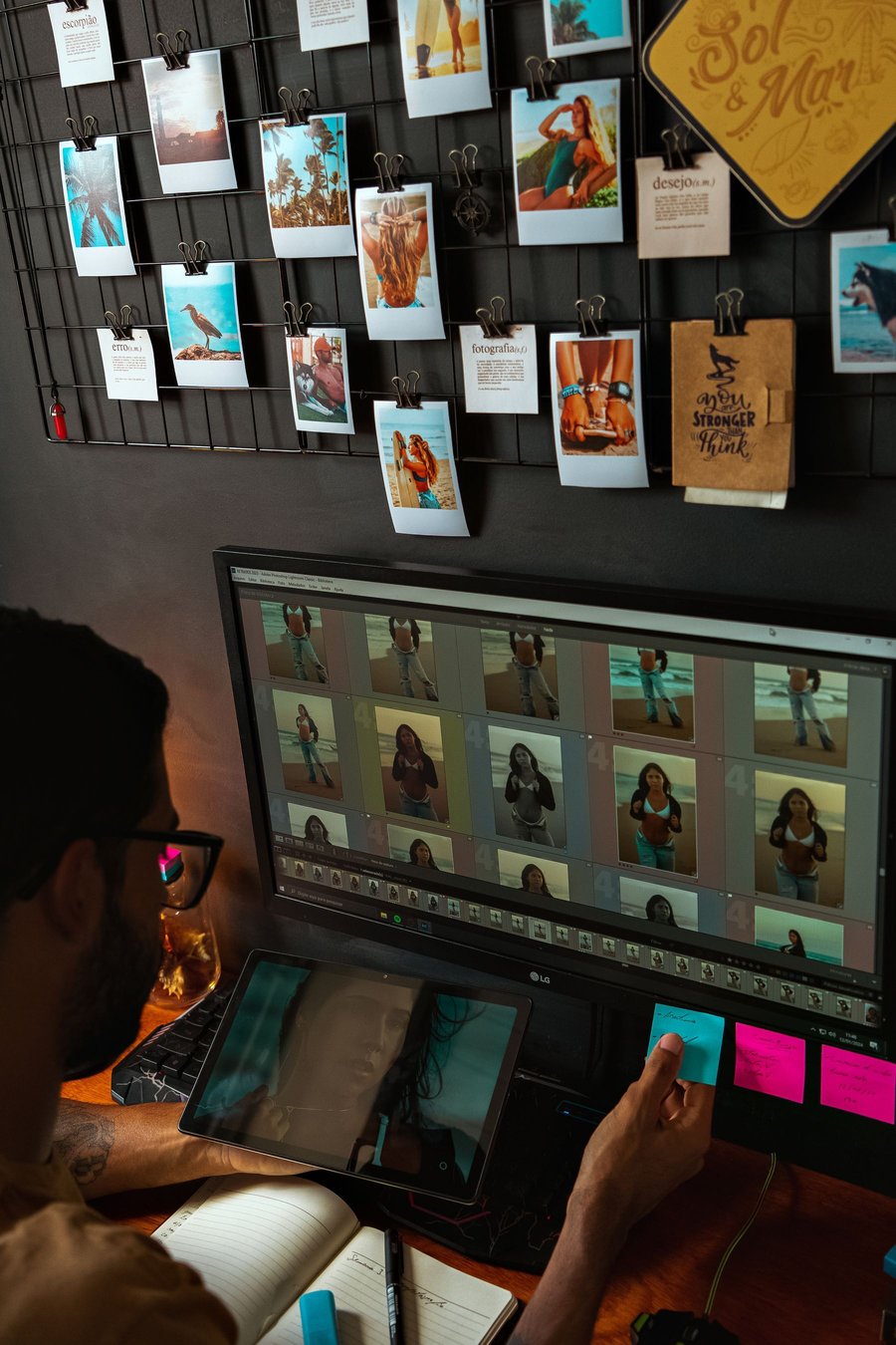 Editor reviewing portraits on two monitors