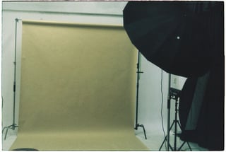 Empty photo studio with backdrop and lights