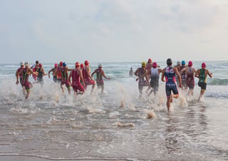 Triathletes starting an ocean swim