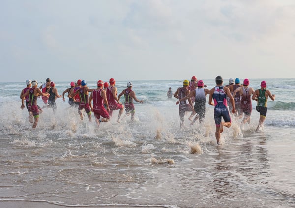Triathletes starting the ocean swim