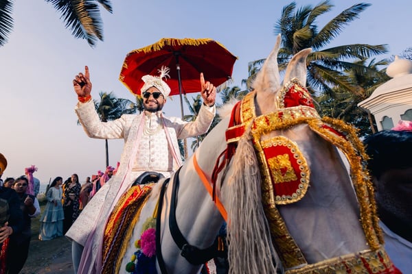 Groom on a horse during a baraat procession