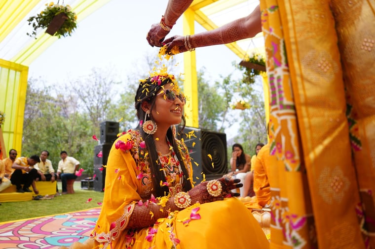 Guests celebrating at a haldi ceremony