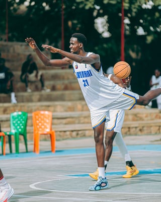 Basketball player wearing jersey number 21