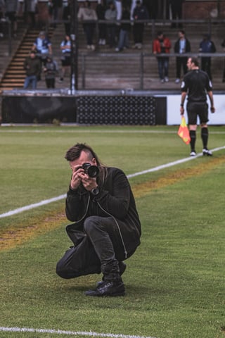 Sports photographer shooting from the sideline