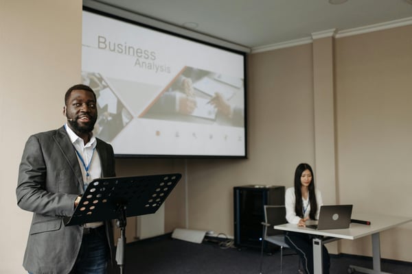 Speaker presenting at a conference