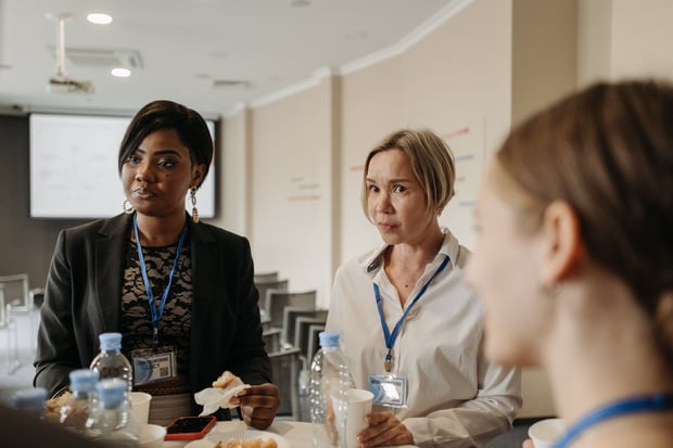 Attendees networking at a conference