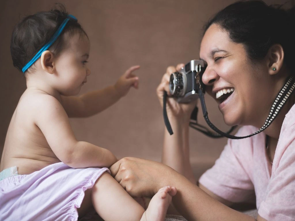 photo of a photographer capturing a baby