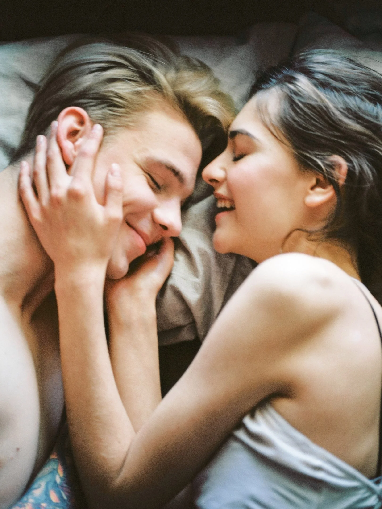 Couple Close Eyes Laying in bed 