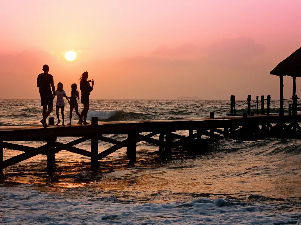 Silhouettes of a family at the beach