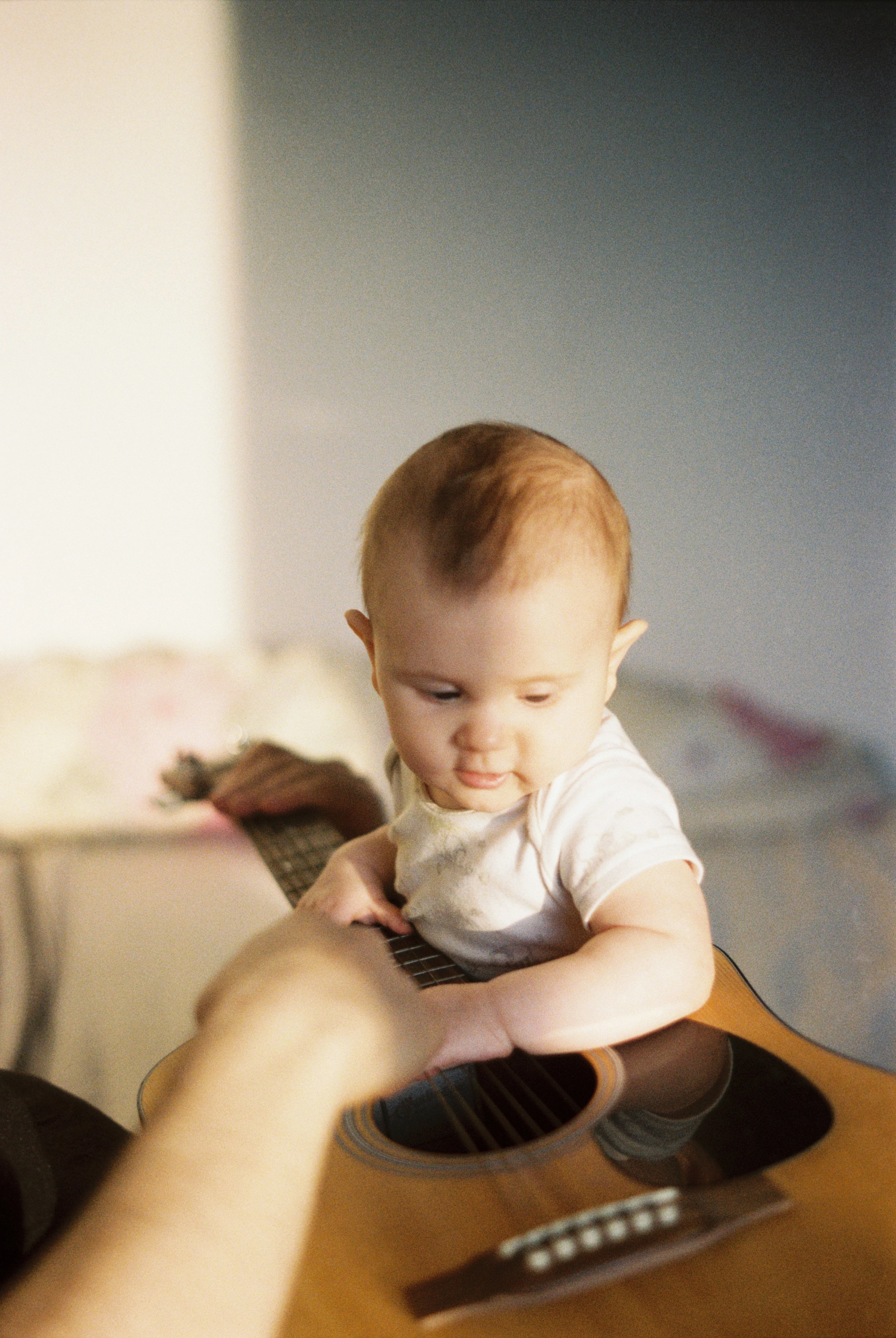 Baby holding a Guitar