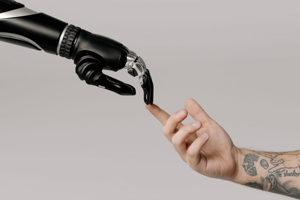 a robot hand and a human hand