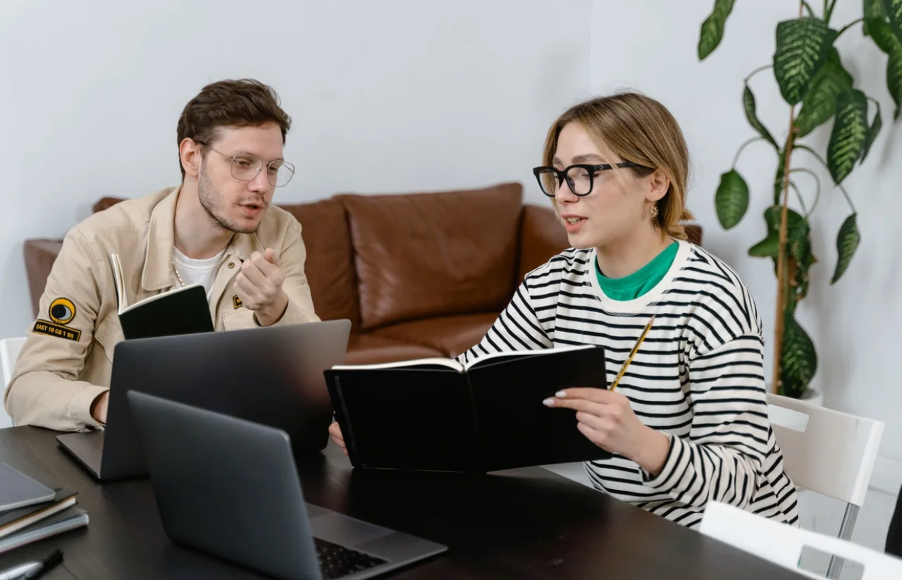 Couple in Spectacles Discussing